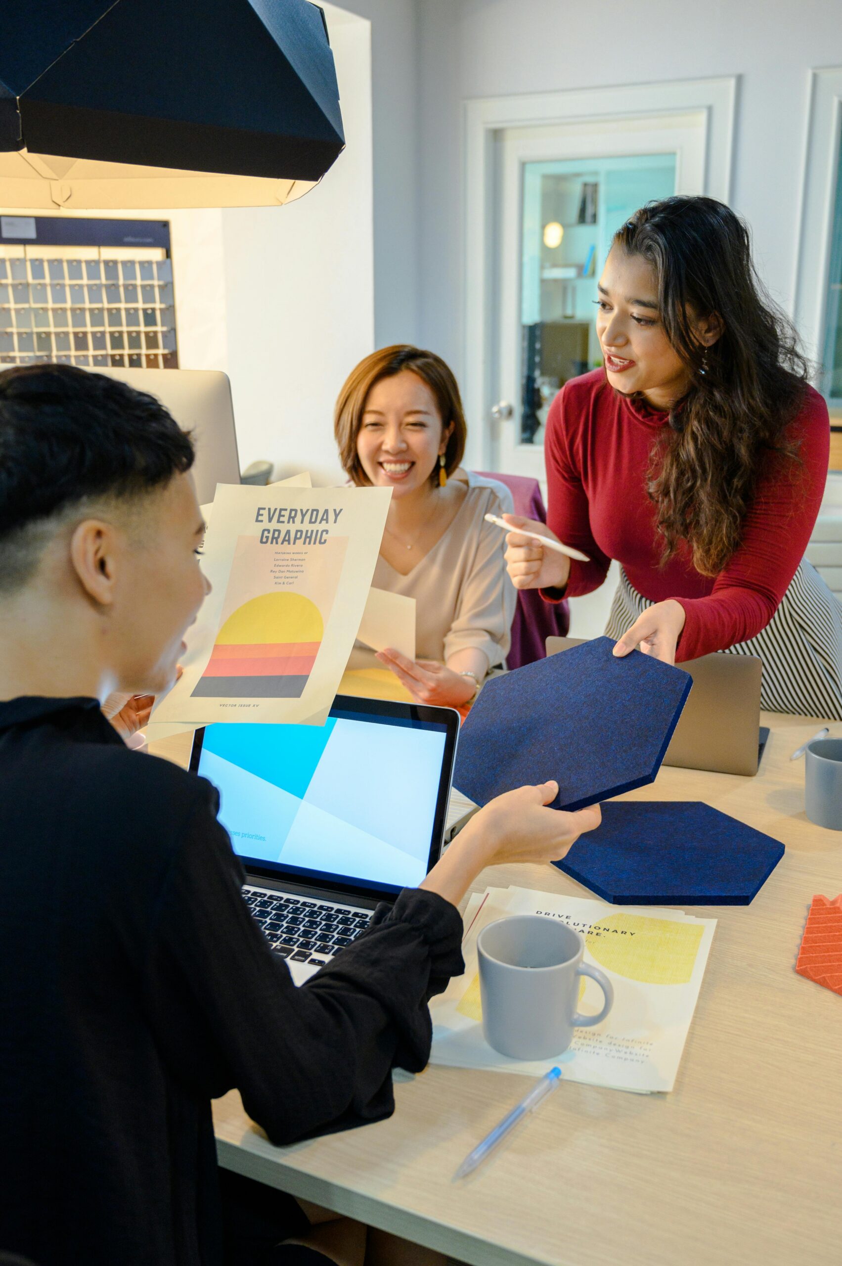Diverse team discussing design ideas in a modern office environment.